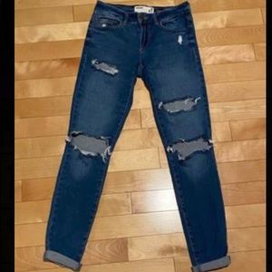 low waisted dark blue ripped jeans